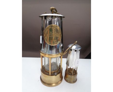 An Eccles Protector miner's lamp Type 6 together with a similar smaller miner's lamp 