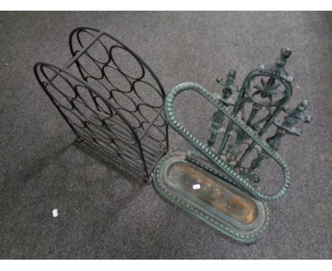 A cast iron Victorian style stick stand together with a metal wine rack 