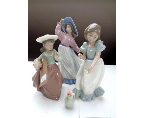 A Nao figure, Caught in the Breeze, no. 1391, with box, together with two further Nao figures of girls. 