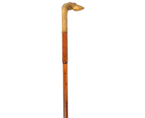A 19th century sword stick, diamond-section blade 29 in., cattle horn handle carved as a deer's foot, retained in the bamboo 