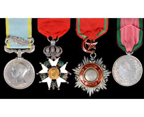 A group of four medals named or attributed to Major Edmund John Carthew, Royal Artillery: Crimea, Clasp: Sebastopol (MAJOR CA