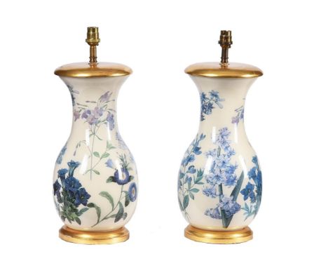 A pair of modern reverse-glass printed botanical baluster lamp bases, decorated with flower sprays reserved on a white ground