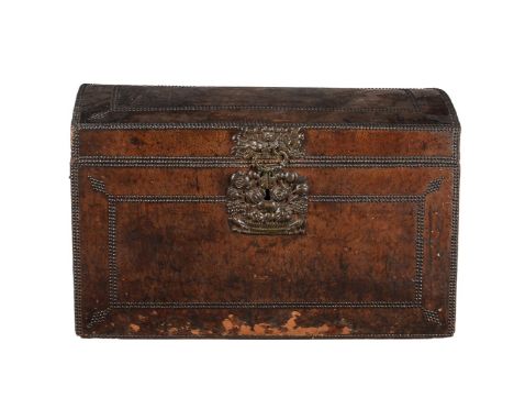 A studded leather trunk, 19th century, the domed lid enclosing a compartment and with further studwork to the interior of the