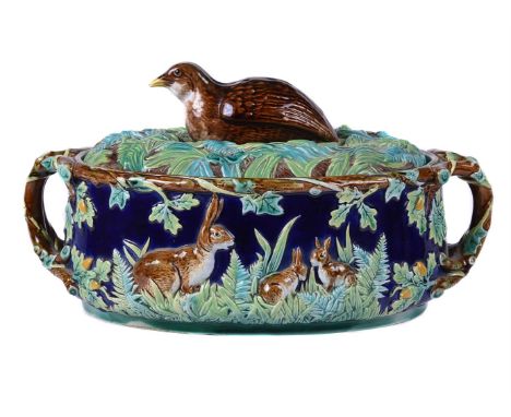 A George Jones majolica two-handled game-pie tureen, cover and pie-liner, circa 1875, the grass modelled cover with partridge