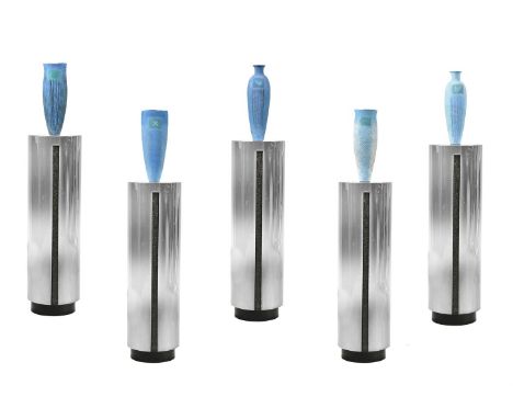 λ Nancy Angus (b. 1958), a group of five coiled ceramic vases, each approximately 40cm high, and on a polished metal column, 