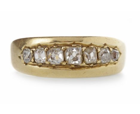 LATE VICTORIAN DIAMOND RING
in the form of a tapered set with graduated old cushion cut diamonds totalling very approximately