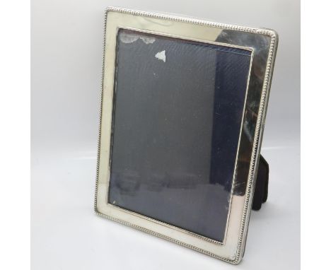 Hallmarked silver photograph frame, London assay, overall 16 x 22 cm. UK P&amp;P Group 3 (£30+VAT for the first lot and £8+VA