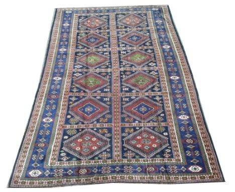 Yalameh carpet, with panels of diamond-shaped medallions with flowerheads, 198 x 329cms.