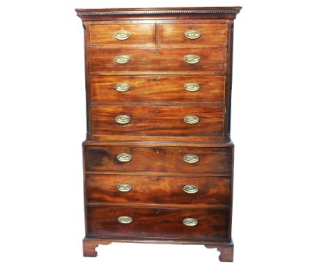 A George III mahogany chest on chest, the dentil cornice above two short and six long drawers, the top section with fluted ca