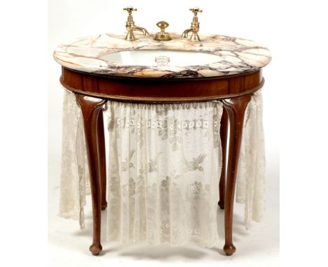 An early 20th Century marble-topped sink , manufactured by Shanks &amp; Co, Scotland, dated 1922, raised on oval mahogany bas