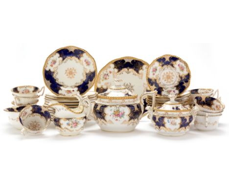 A Coalport bone china tea service, circa 1910, each piece printed and painted with flower sprays, within gilt and blue border