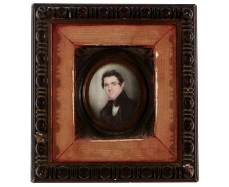 19th Century British School A miniature bust portrait of a young gentleman wearing a black coat and stock, bodycolour on ivor