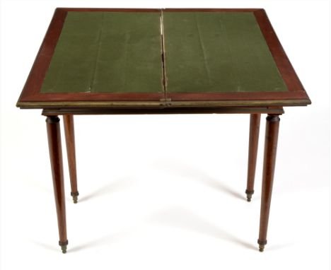 A French mahogany and brass mounted Directoire style card table, the rectangular top with brass mounted edge, enclosing a gre