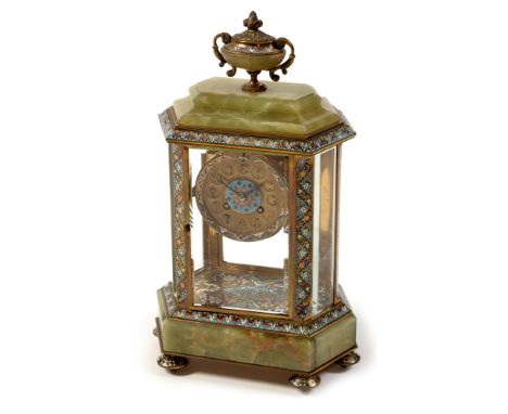 A French 19th Century champleve enamel and onyx six glass mantel clock, the stepped onyx top surmounted by an enamelled finia