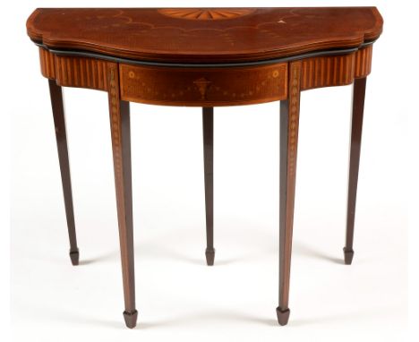 An Edwardian fiddle-back mahogany inlaid and satinwood banded serpentine card table , the hinged and shaped top with inlaid s