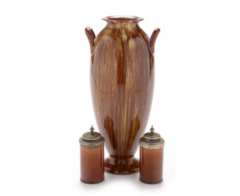 A Linthorpe art pottery vase, 1879-1889, of plain oval form with double loop handles, brown and cream streaked glaze, impress