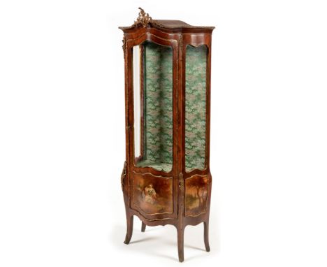 A late 19 th Century Louis XV style kingwood vitrine , the arched top with giltmetal finial above a shaped glazed door and si