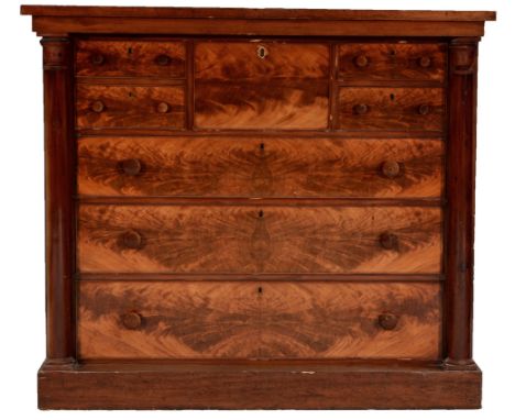 A Victorian mahogany Scotch chest of drawers , the rectangular top above an arrangement of seven drawers flanked by turned co