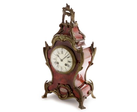 A 19th Century French tortoiseshell and giltmetal mounted mantel clock, in the rococo taste, the 10cms white enamel dial with