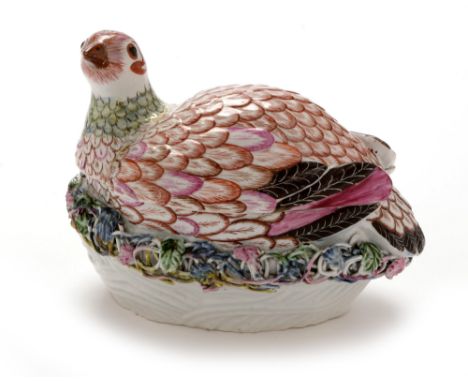 A Worcester partridge tureen and cover, circa 1760 , of naturalistic form on an oval basketweave base, applied with tendrils 
