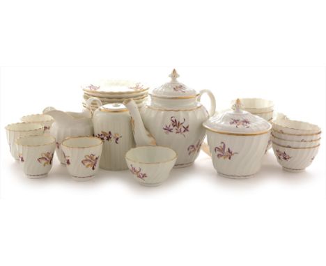 A Flight period Worcester tea and coffee service, circa 1785, each piece of wrythen moulded form, painted with puce and gilt 