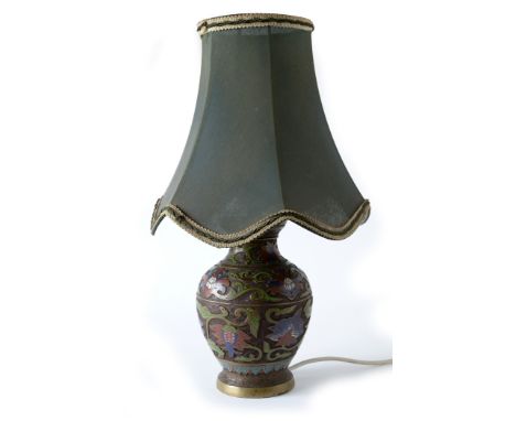 A late 19th/early 20th Century Chinese Champleve enamel ovoid vase lamp, with floral decoration on a cast cellular diaper gro