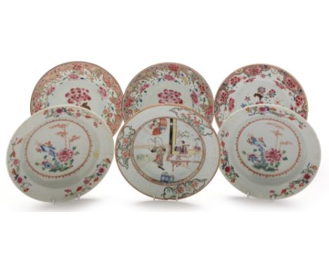 A pair of Chinese Famille Rose plates , Qianlong, decorated with peony within a floral and iron-red scroll border, 23cms diam