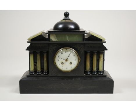 A black marble and onyx mantel clock
