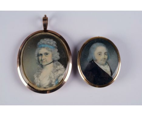 Two early 19th century portrait miniatures within pendant mounts    Conditon Report:  Smaller example- blue glass reverse cra