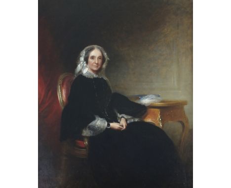 British school, late 19th century, Portrait of a lady, three quarter length seated wearing black at a table, oil on canvas, 6