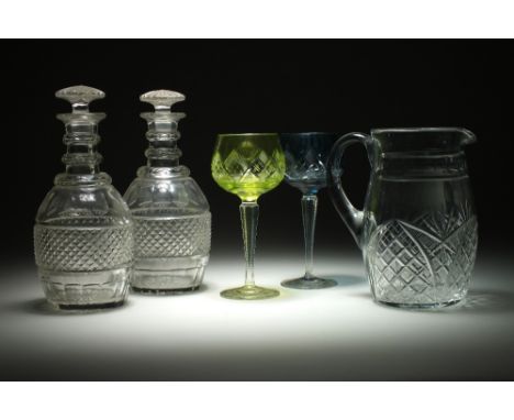 A pair of cut and faceted glass decanters and stoppers together with various other decanters and stoppers, 19th century and l