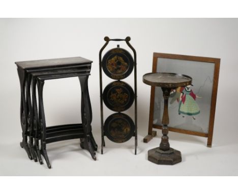 A Chinoiserie lacquered nest of quartetto tables, 1920s, each decorated with a scaly dragon, the largest 53cm wide, a 1920s C