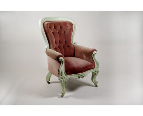 A Victorian button back easy chair with later painted lime green scroll frame and crimson covers raised on squat cabriole leg