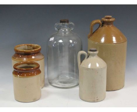 Two ceramic flagons, one marked 'Whiteways' on the lid, two ceramic jars with one glass flagon, tallest flagon is 34cm (5)