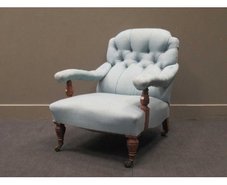 An Edwardian walnut armchair with blue button back upholsteryStructually the front legs have a bit of give. Upholstery is fra