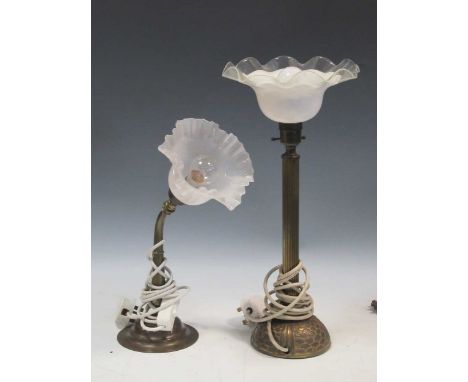 Two brass table lamps with opaque shades, 44cm and 36cm high, and another opaque glass lamp base, 34cm high