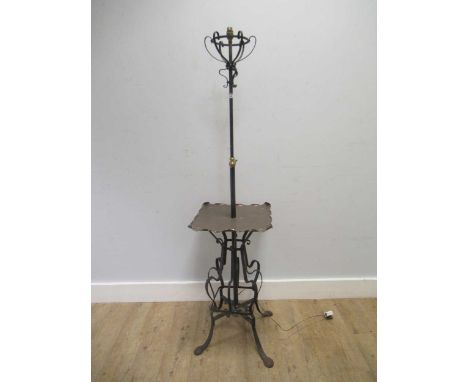 In the manner of WAS Benson, an Arts &amp; Crafts wrought iron and copper standard lamp, 153cm high