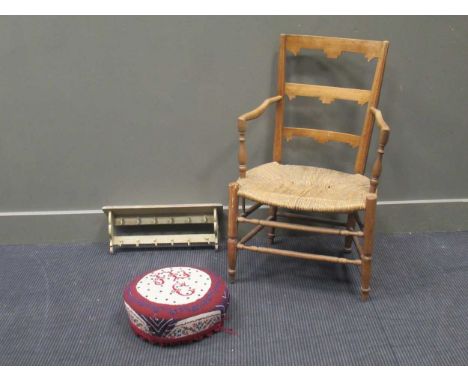 A French rustic ladder back armchair, a needlework footstool and small painted white shelf