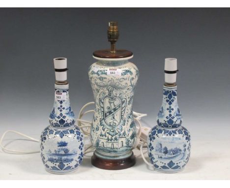 Pair of 20th century Delft lamps 31.5cm high, together with a larger blue and white lamp, possibly Italian 39.5cm high