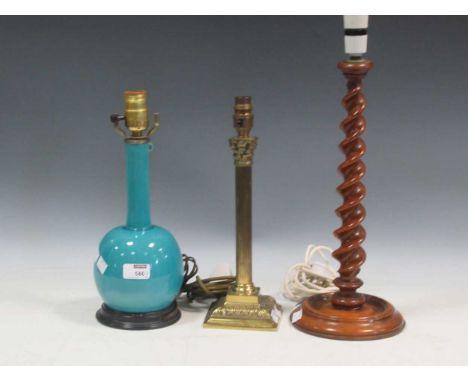 A collection of three lamps: A blue glaze lamp 34cm high, brass column lamp 33cm high and a turned walnut candlestick lamp 46