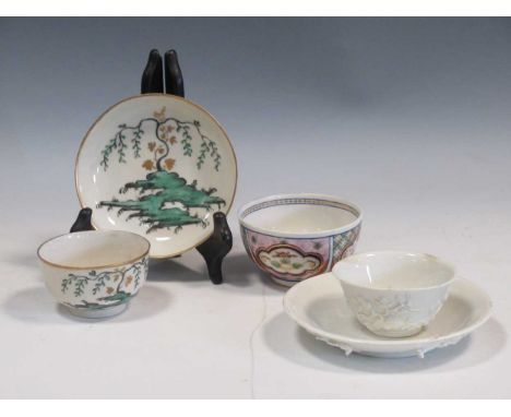 An English porcelain blanc de chine prunus moulded tea bowl and saucer, a Worcester tea bowl and saucer decorated with a will