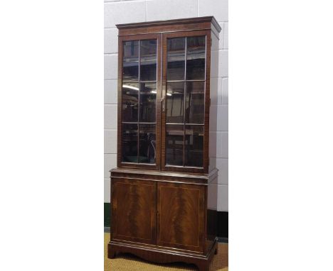 An Edwardian mahogany glazed cabinet rasied on splayed bracket feet 169 x 85 x 35cm together with a reproduction mahogany gla