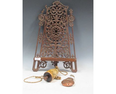 A decorated powder horn and a copper shot flask, together with a carved and pierced table-top easel