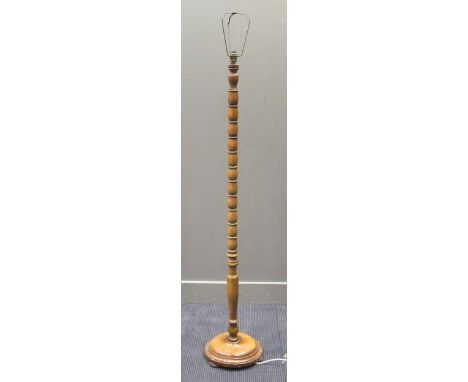 A 20th century walnut bobbin turned standard lamp, 167cm high