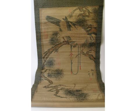 A large Chinese hanging scroll depicting a hawk