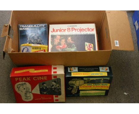 A box containing a boxed Casdon junior 8 projector, a boxed peak cine projector, a boxed air fix filmoscope pocket viewer, a 