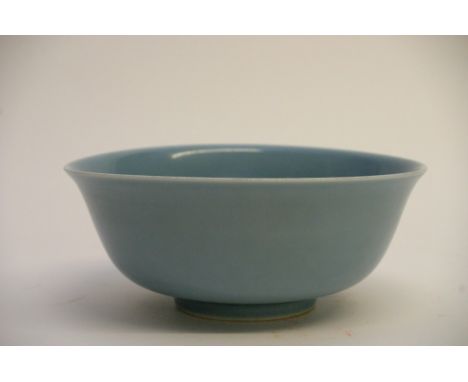 A Chinese blue glazed bowl having six character Xuande mark within a double ring to the base. Diameter: 20cm approximately