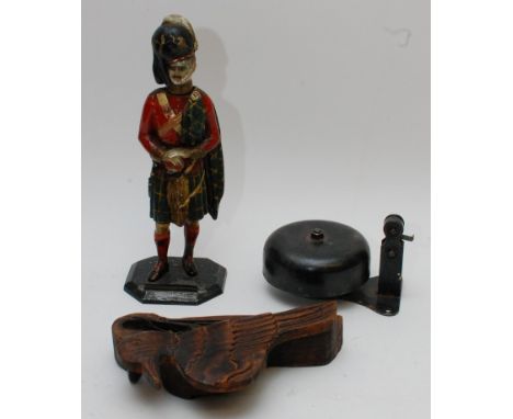 A painted spelter table lighter in the form of a Scottish military figure in kilt, together with an old bell and a set of sca