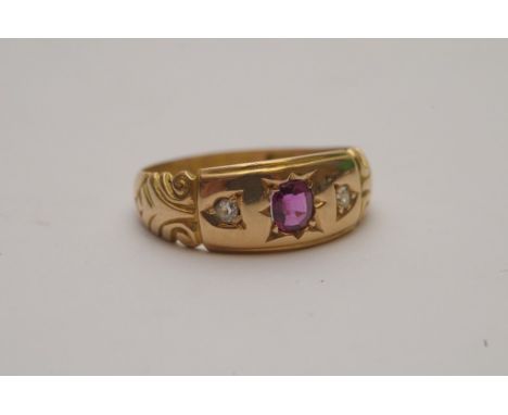A ladies 18ct gold ring set with ruby and diamonds bearing Chester hallmarks