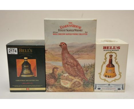 A boxed Royal Doulton Scotch Whisky grouse decanter in original box and two bottles of Bells whisky (3) 